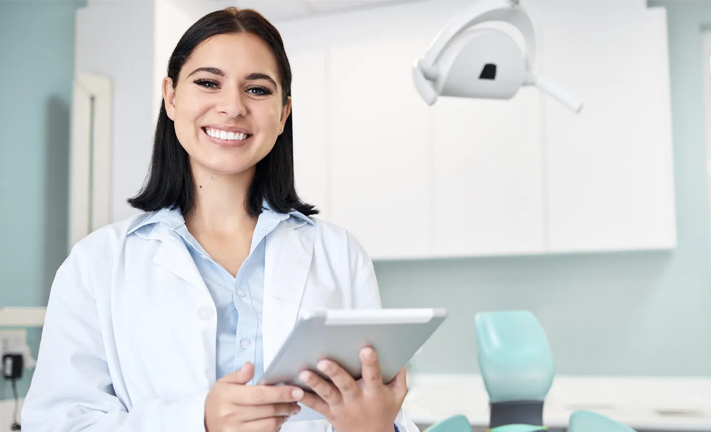 Dentist holding an iPad.